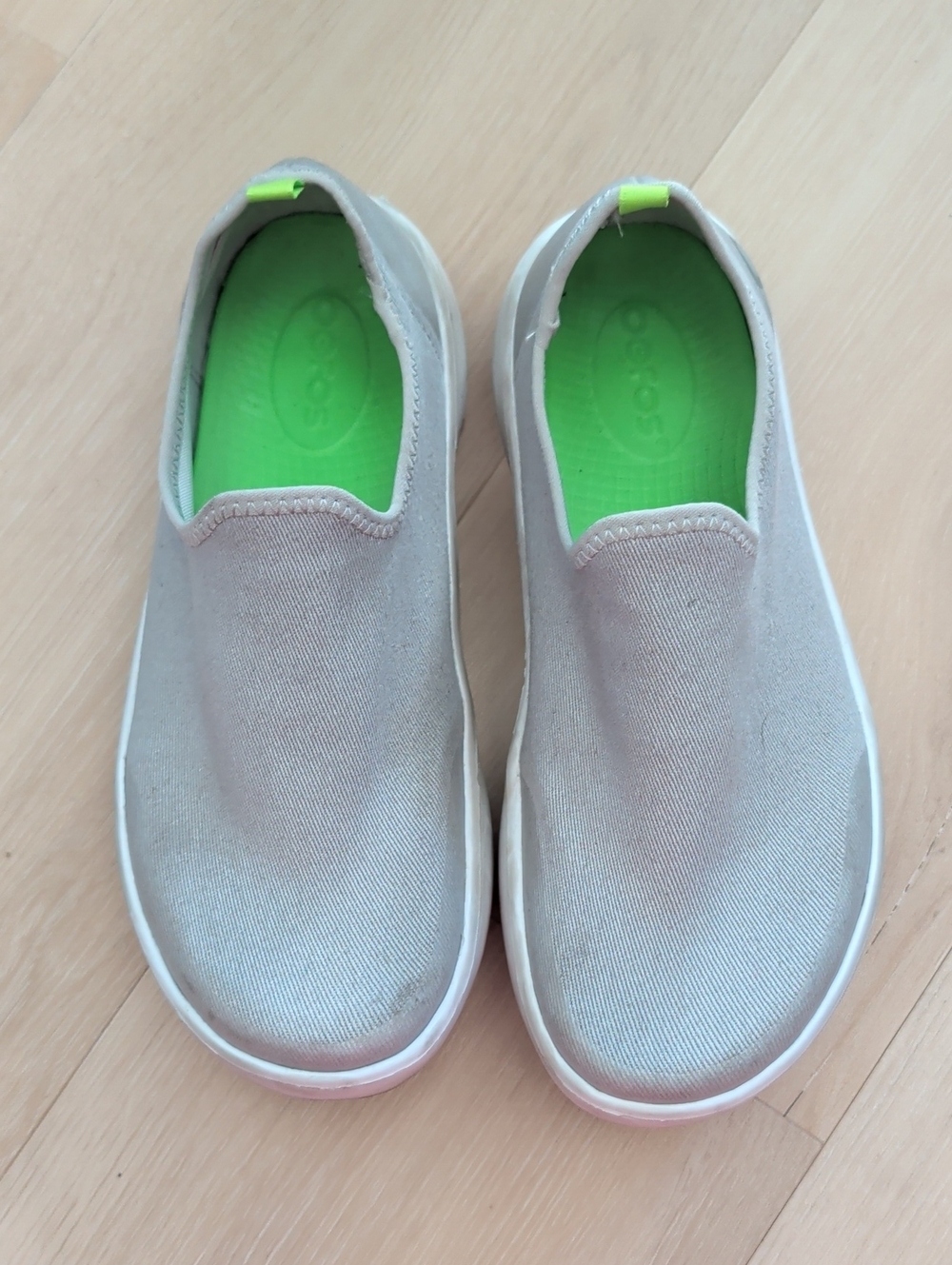 Oofos Slip-On Canvas Sneakers in Light Gray with Green Insole